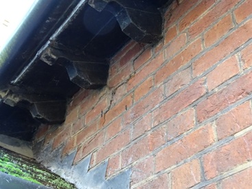Brickwork cracked due to roof pushing out gable end.